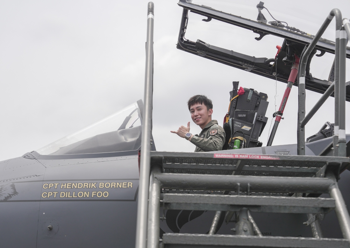 Captain Zane Lim poses for a photo in the cockpit of the F-15SG.