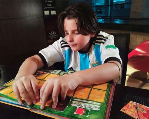 Blind Venezuelan boy converts World Cup sticker album into Braille
